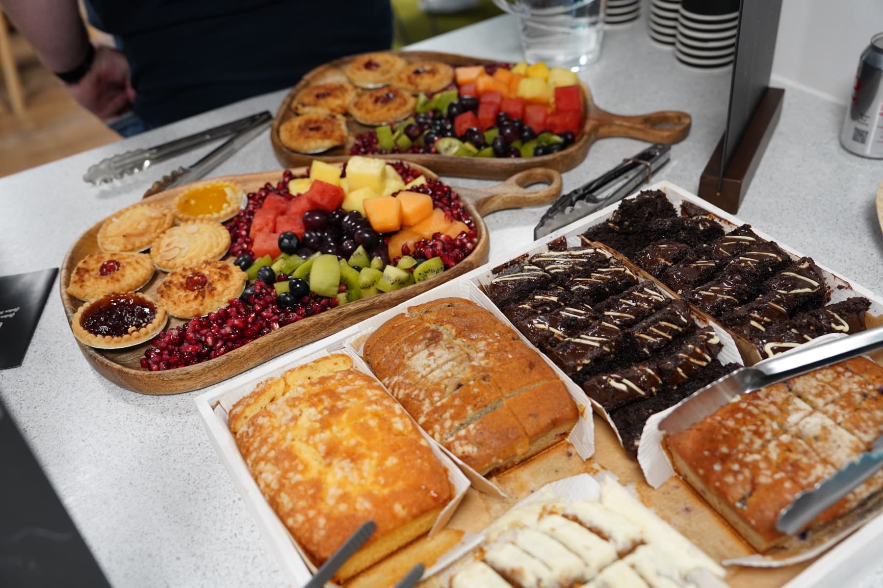 Fruit, pastries and cakes laid out for attendees