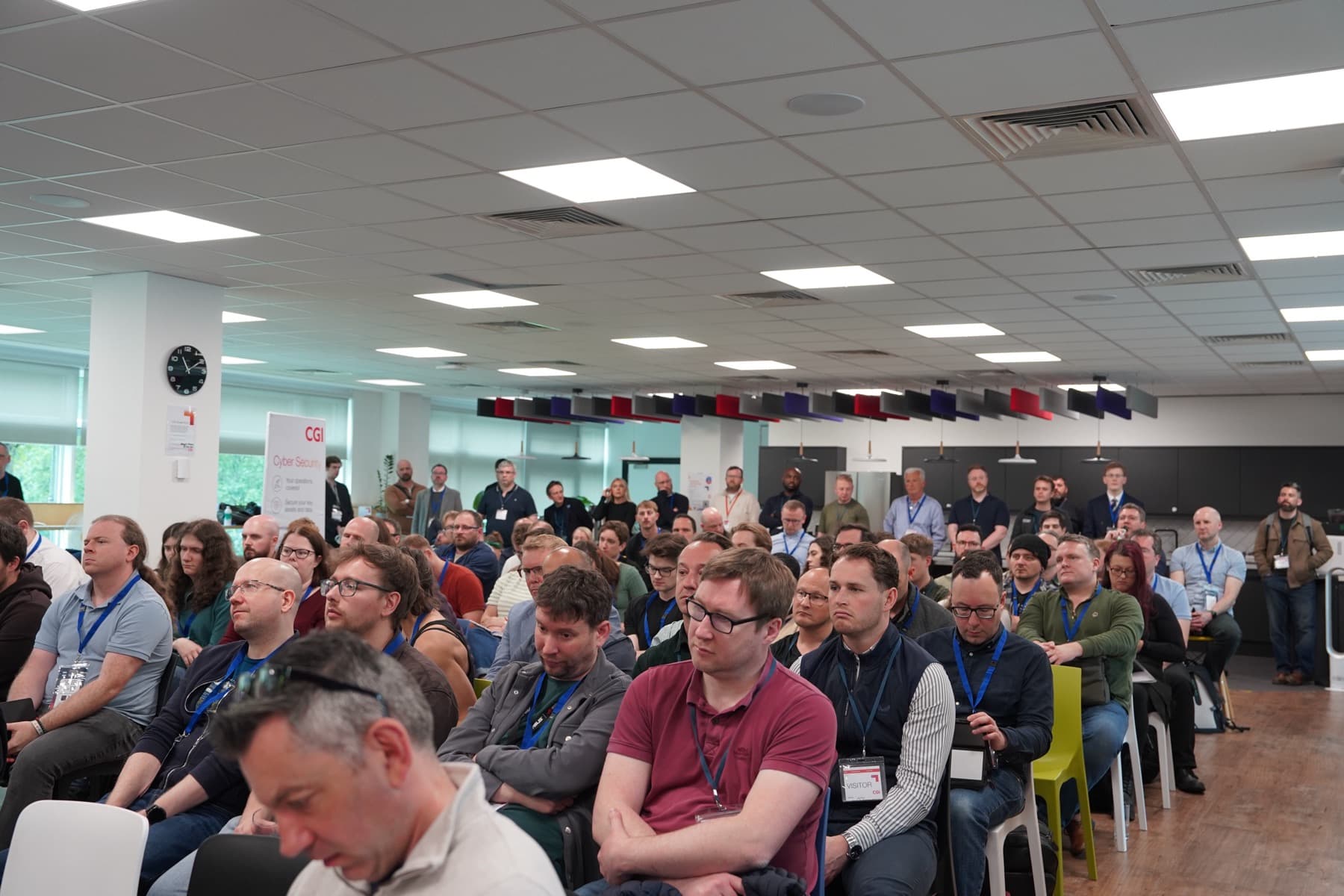 A packed room facing the stage at CGI Leeds