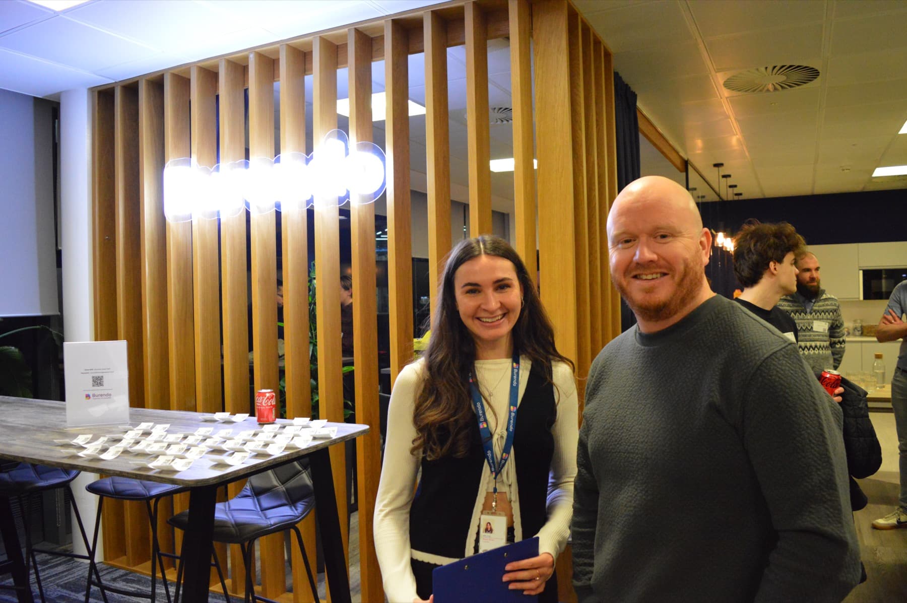 Two attendees smiling at the camera