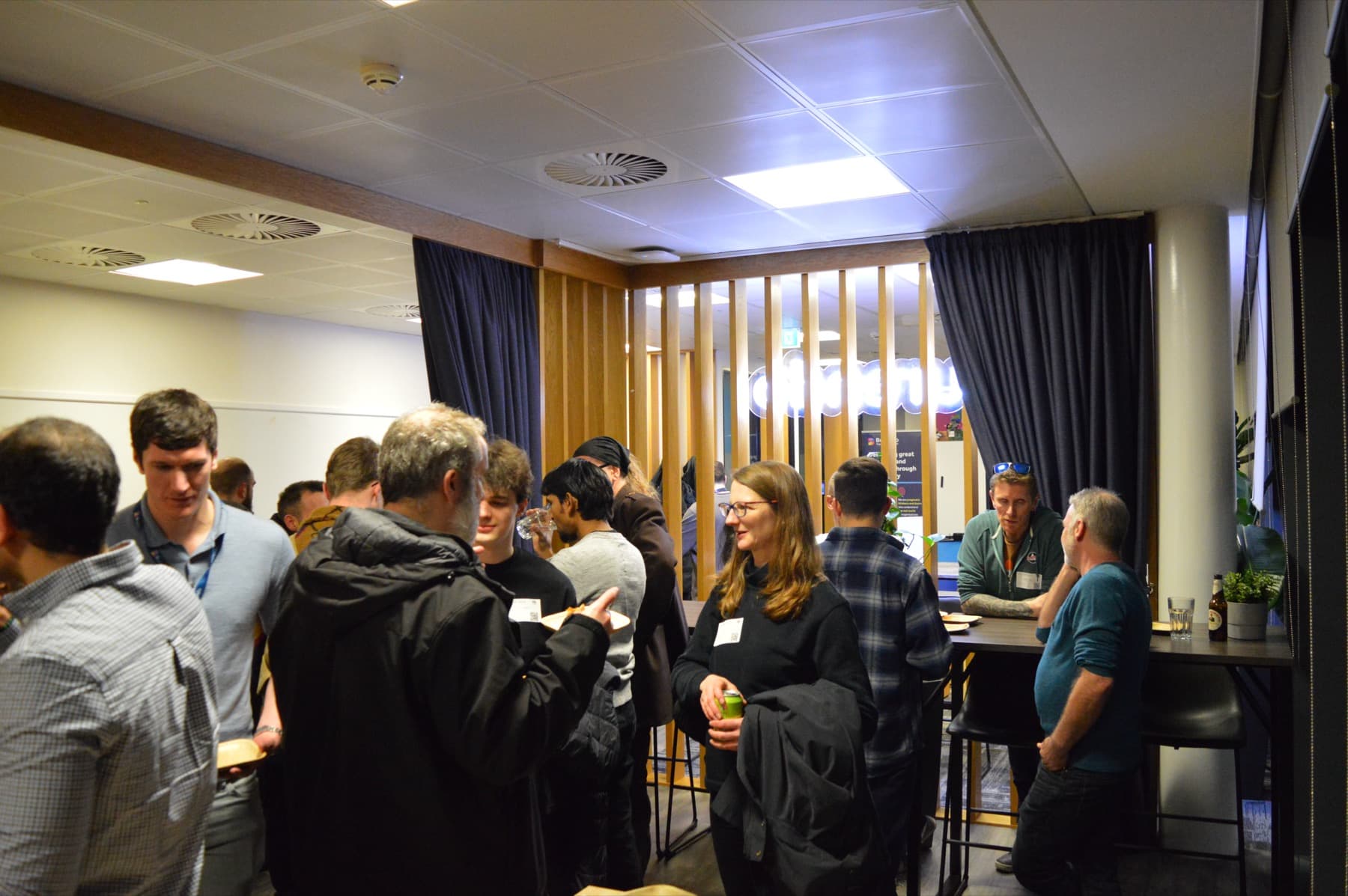 Attendees networking before the talks