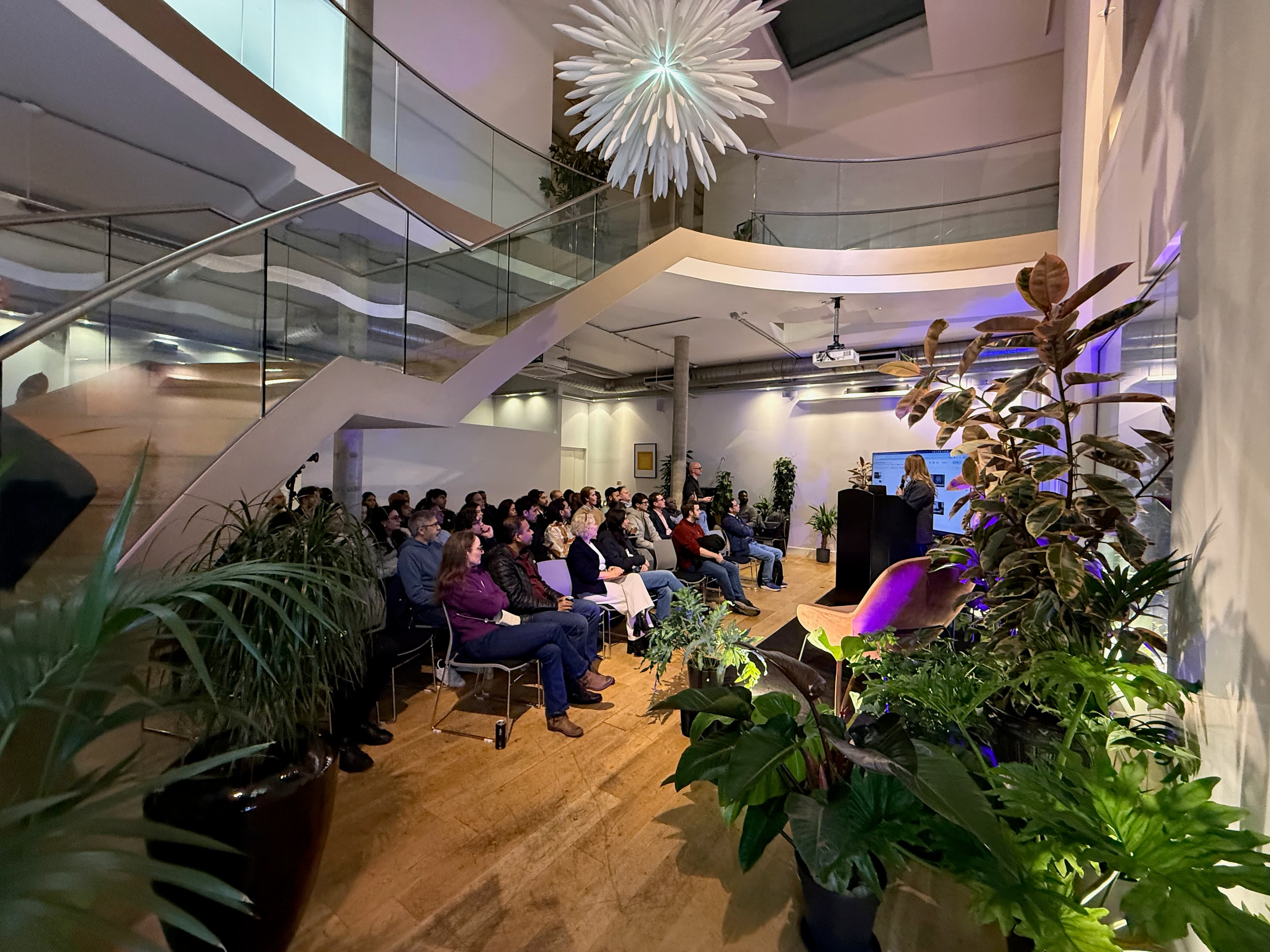 Community event in a venue with a spiral staircase